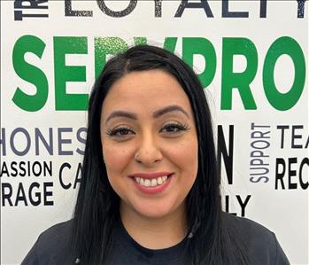 Female employee with long dark brown hair 