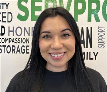 female employee with dark brown slick back hair 