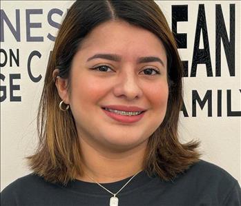 Female employee with long dark brown hair 