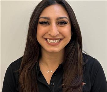 Female employee with long dark brown hair 